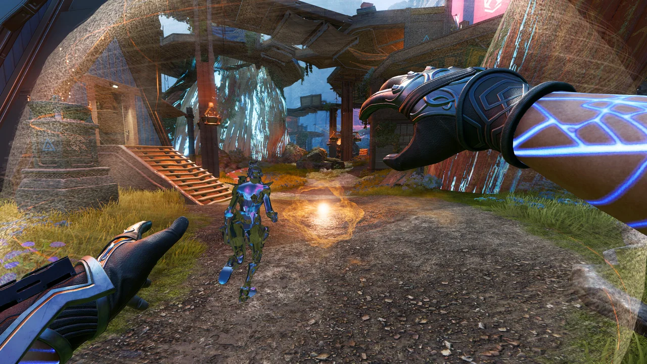 First-person Apex Legends scene with an opponent crossing a glowing arena.