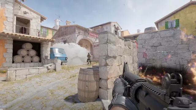 First-person Counter-Strike 2 firefight beside stone buildings and smoke.