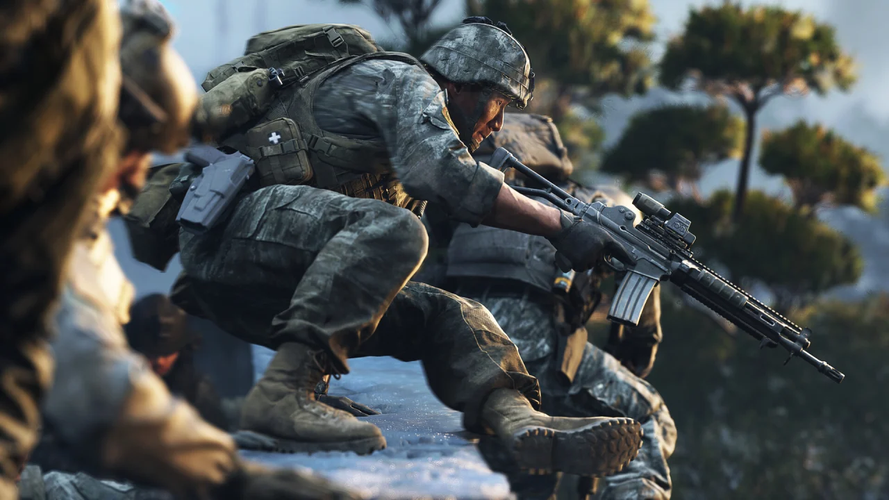 A crouching Call of Duty soldier shoulders a scoped rifle near rocks.