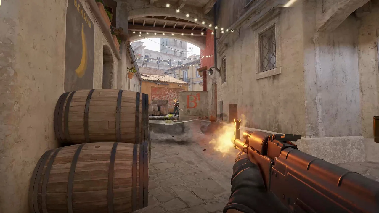 A Counter-Strike 2 player fires an orange rifle between wooden barrels.
