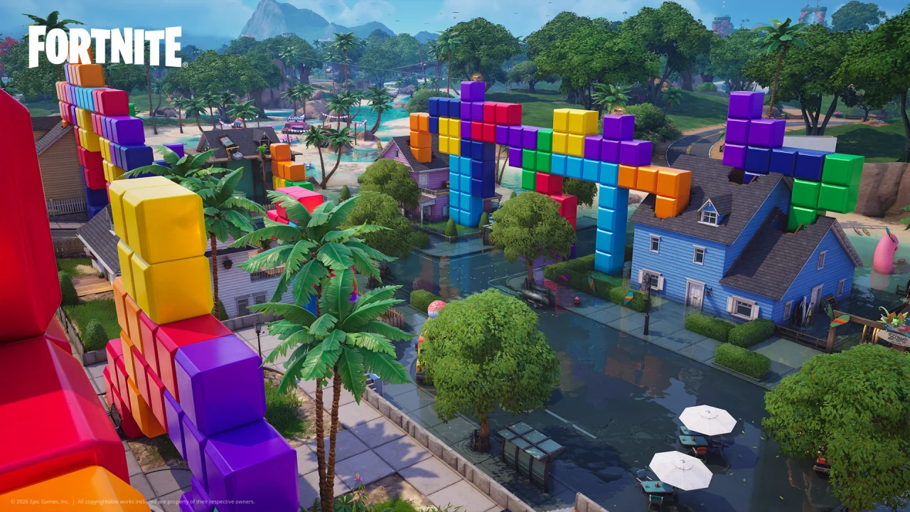 An aerial Fortnite view shows colorful block buildings, streets and trees in official Override artwork.