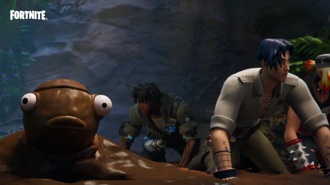 A mud-covered fish character and three teammates crouch together in a jungle.