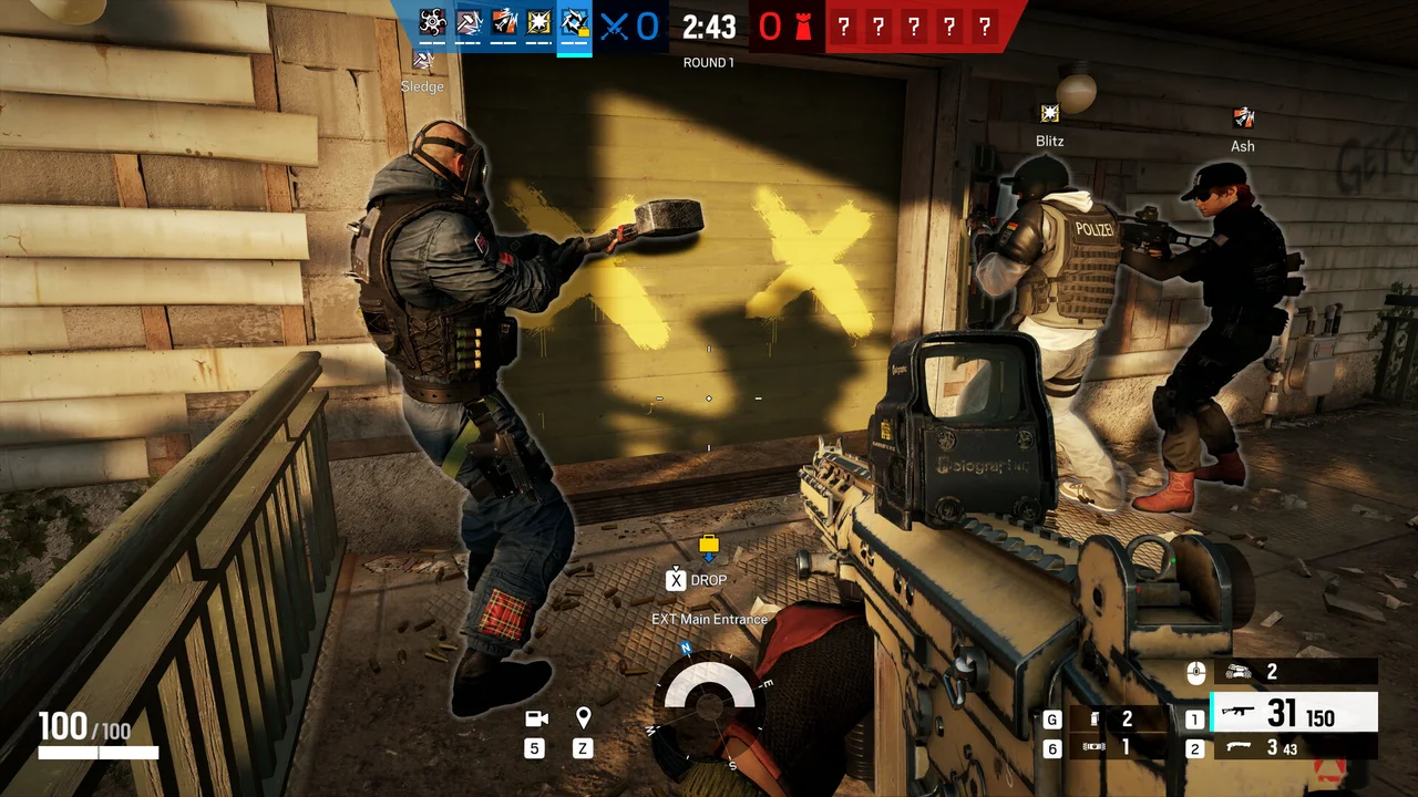 Rainbow Six Siege attackers move through a breached doorway during a match.