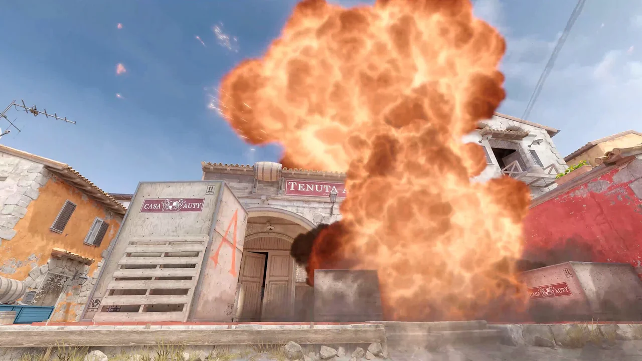 A large fireball rises above a Counter-Strike 2 urban map.