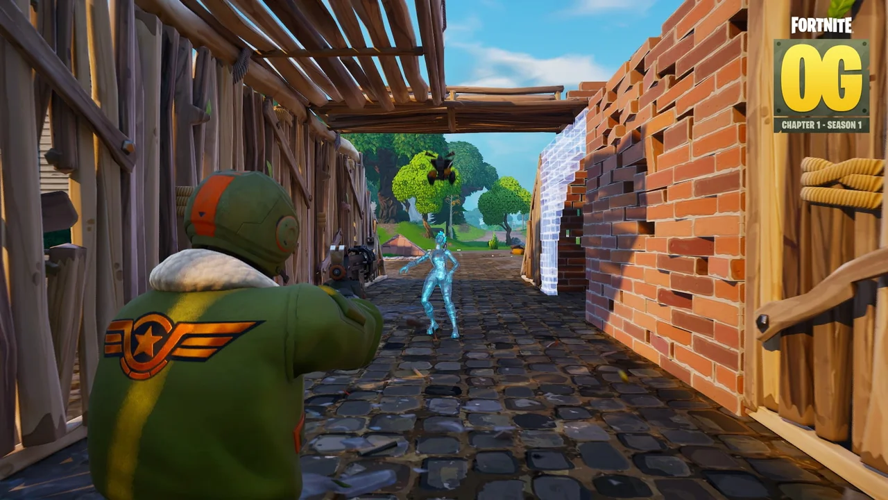 Two classic Fortnite characters face each other between brick and wooden builds.